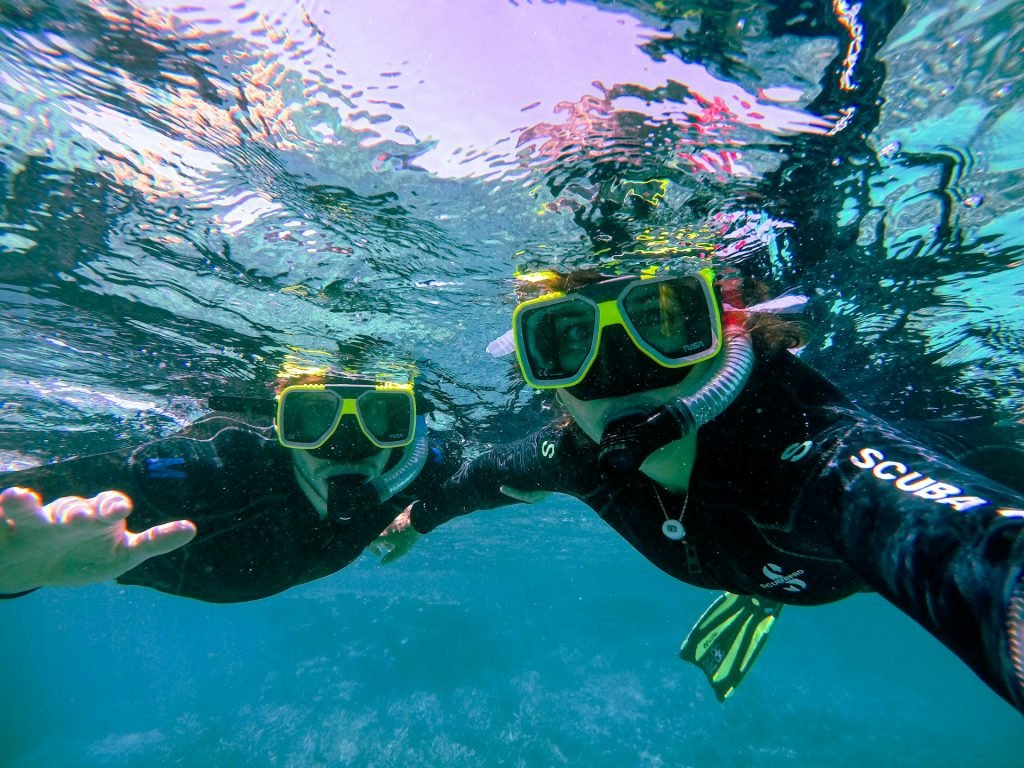 Couple snorkeling on Caribbean excursion during Carnival honeymoon cruise