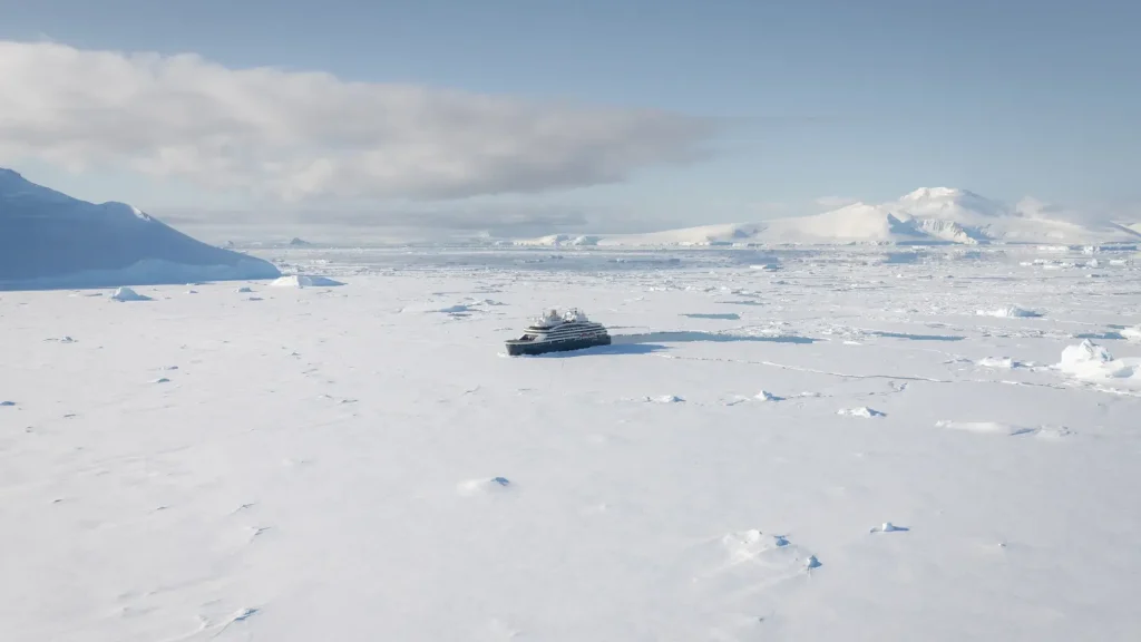Expedition cruise ship navigating Antarctic ice